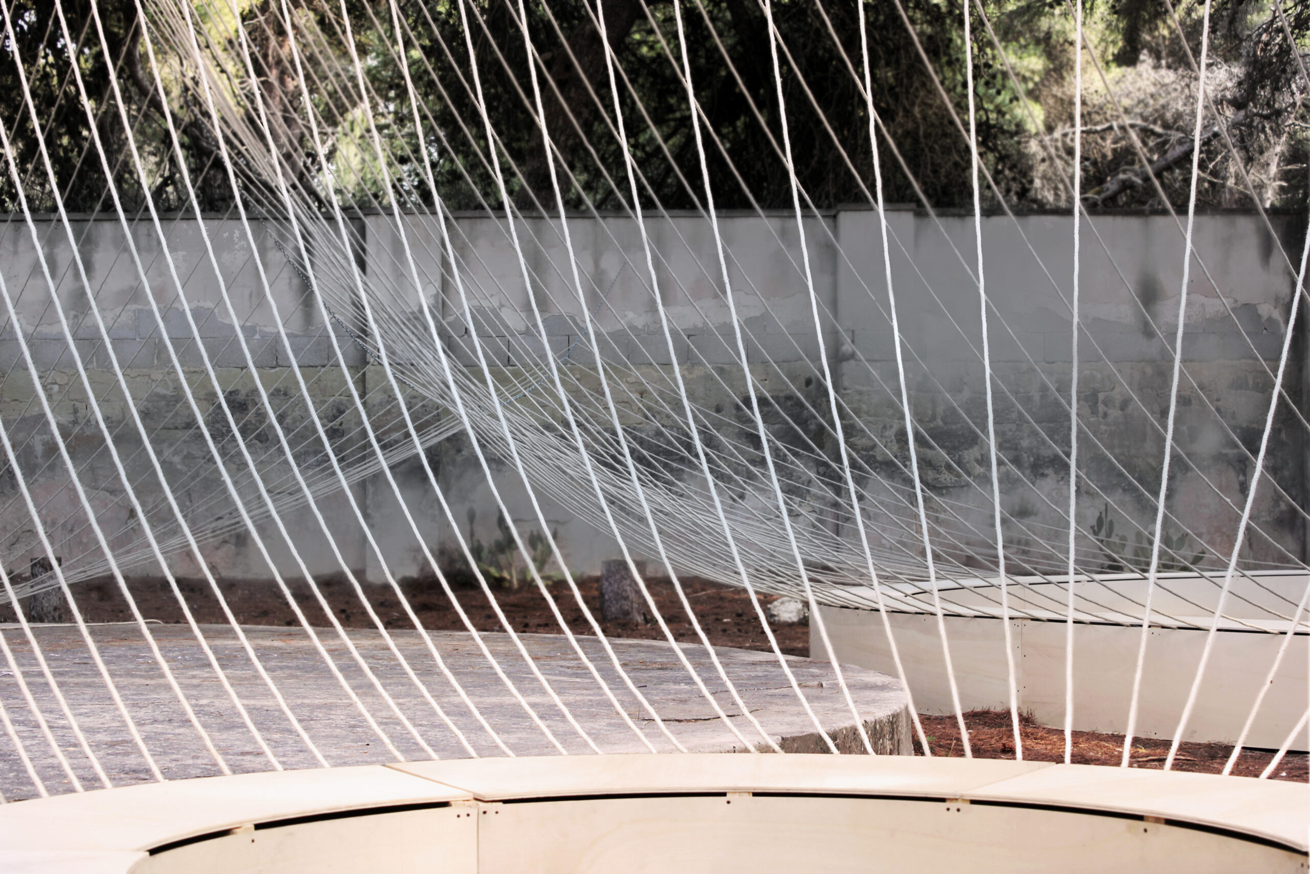 a series of ropes attached to circular benches