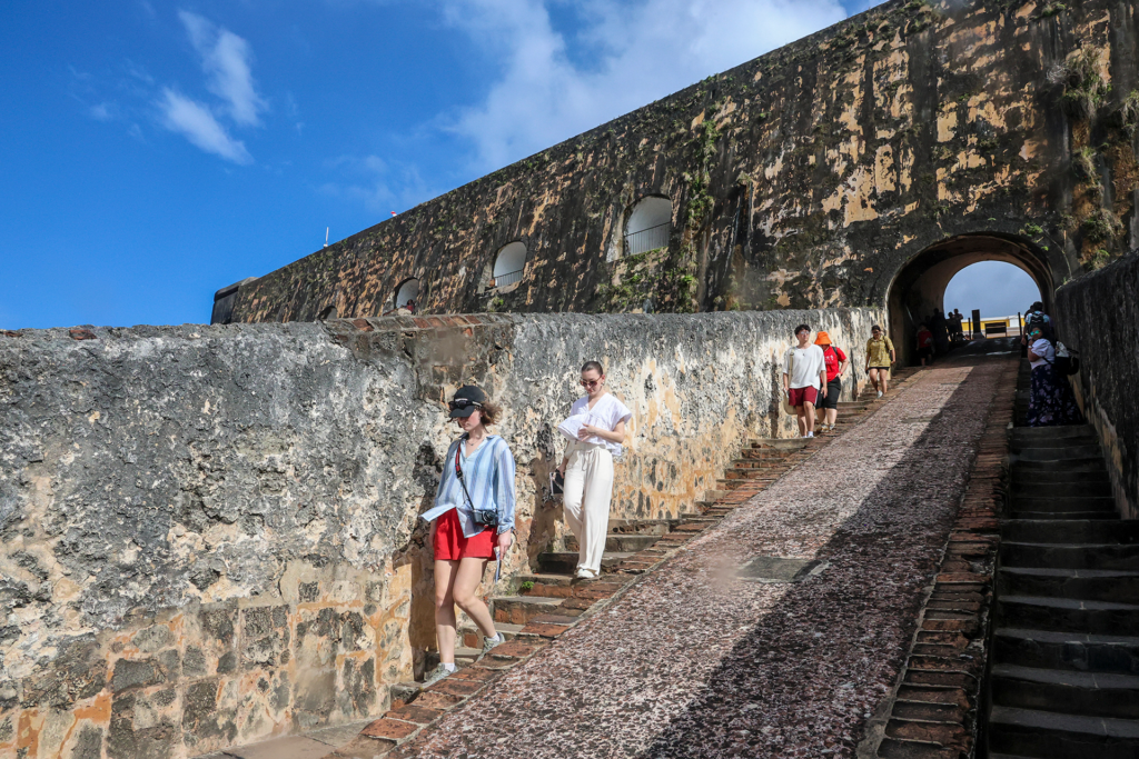 Students walking down stone stairs