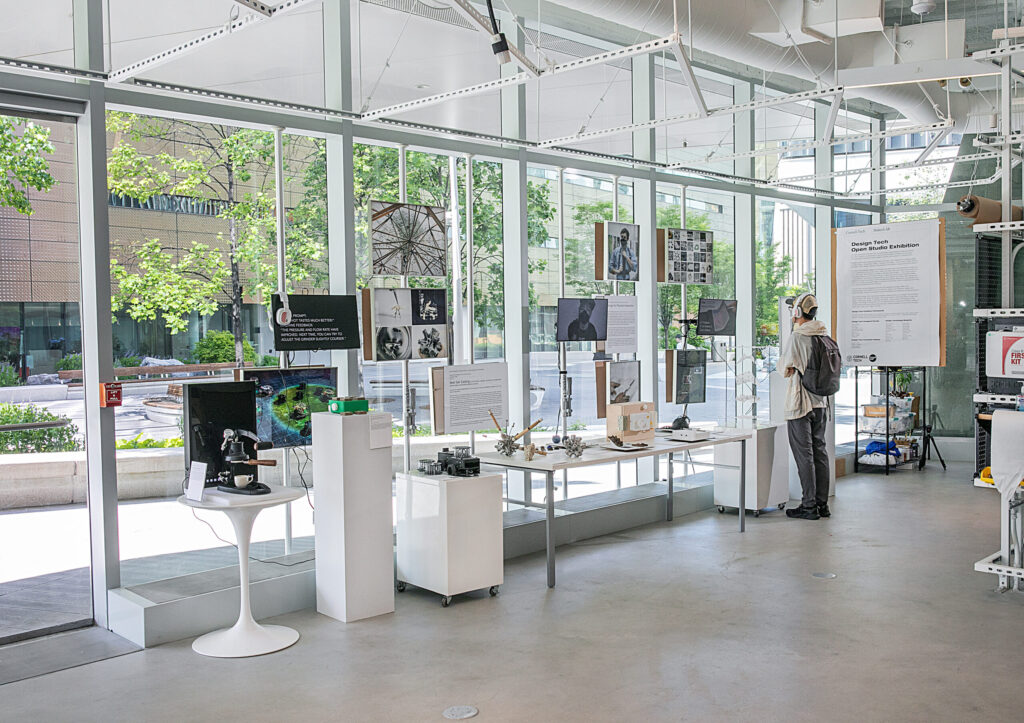 Design Tech Open Studio Exhibition Person viewing work in a gallery space.