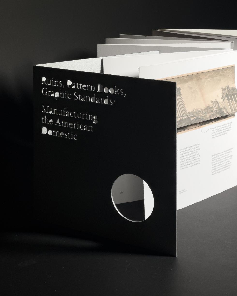 a book with pages unfolding out showing ruins, patterns and graphic standards