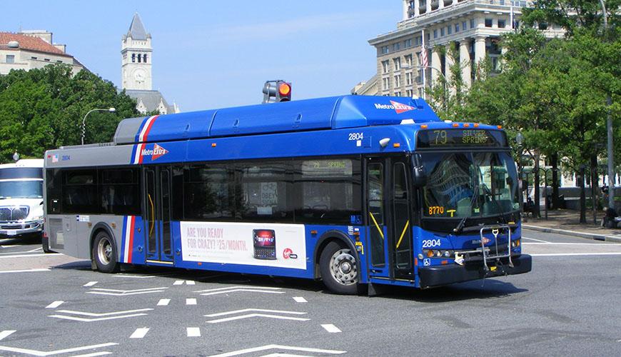 A city bus at an intersection.