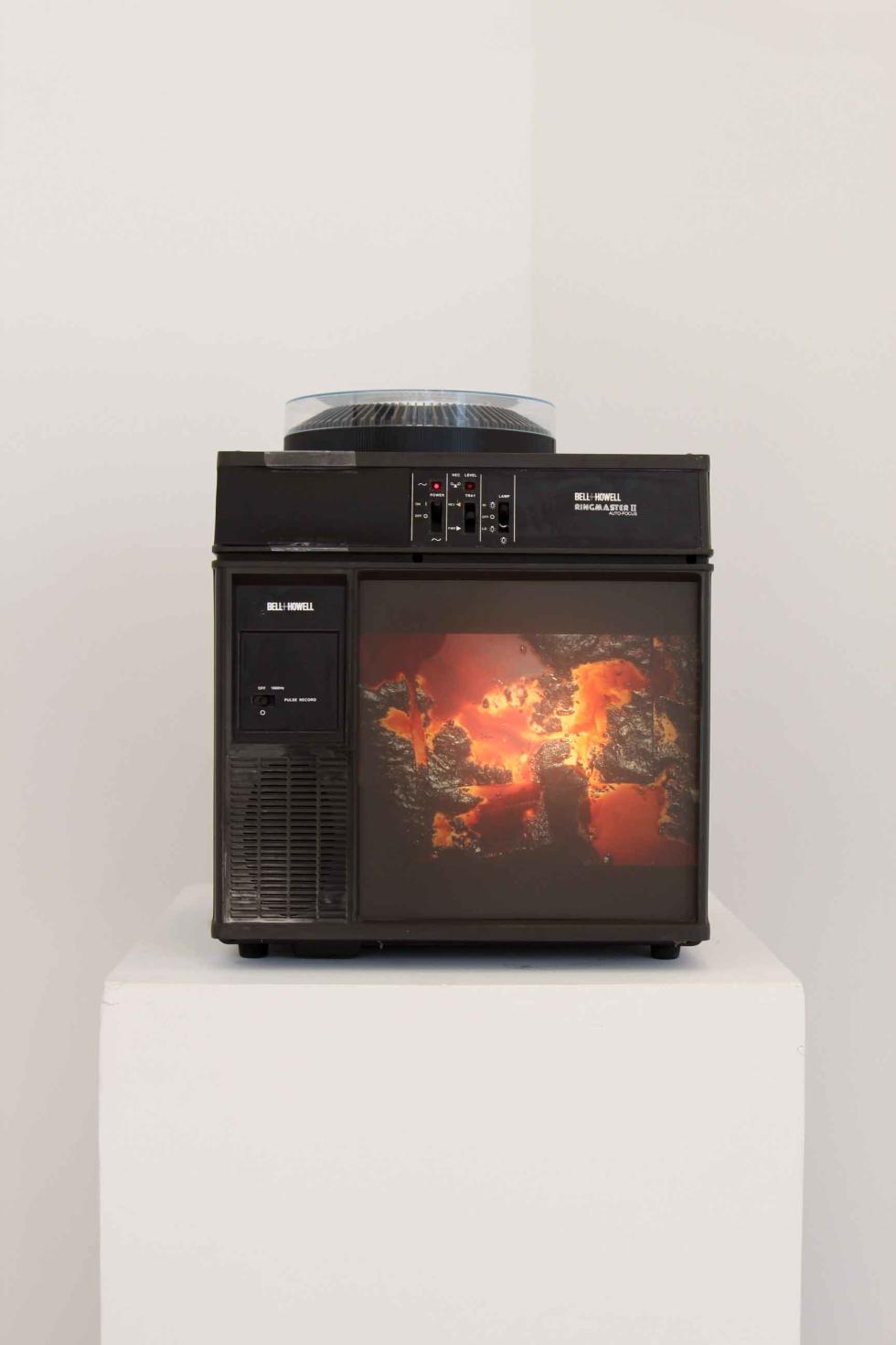 A close up of a projector displaying an image of an abstract artwork.