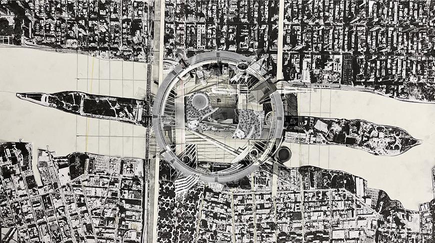 Overhead view of a city center with a circular building in the center.