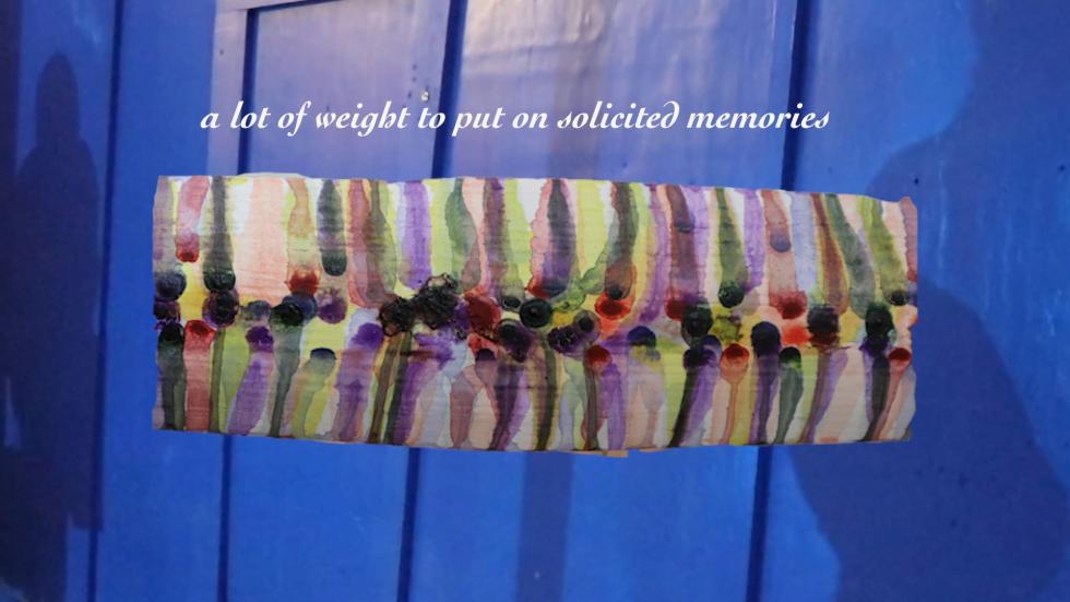 Blue wall in the background with abstract blue, purple, black, and green watercolor in the center.