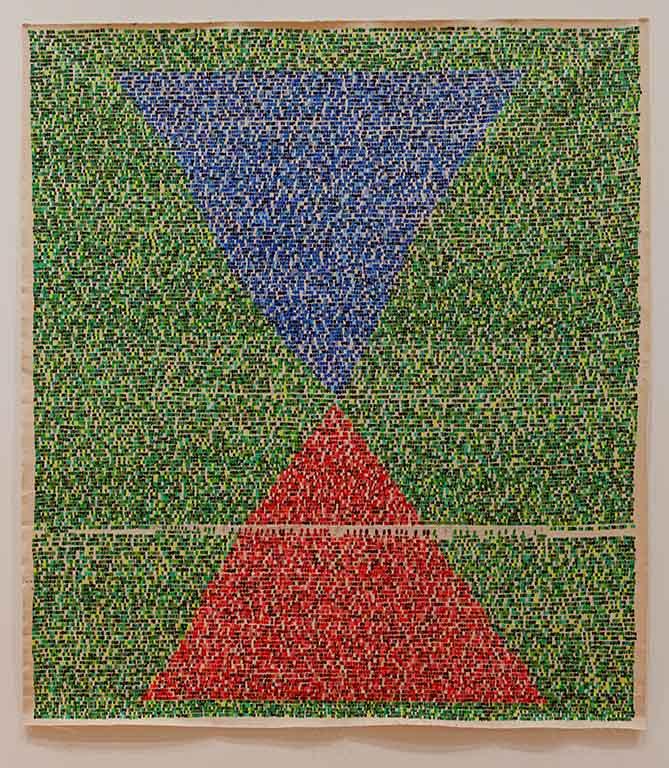 Abstract artwork with two triangles on a green background.