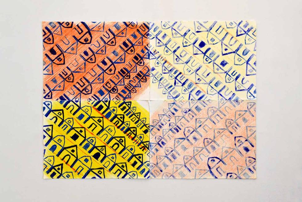 A print of house facades on a piece of paper with yellow and orange backgrounds.