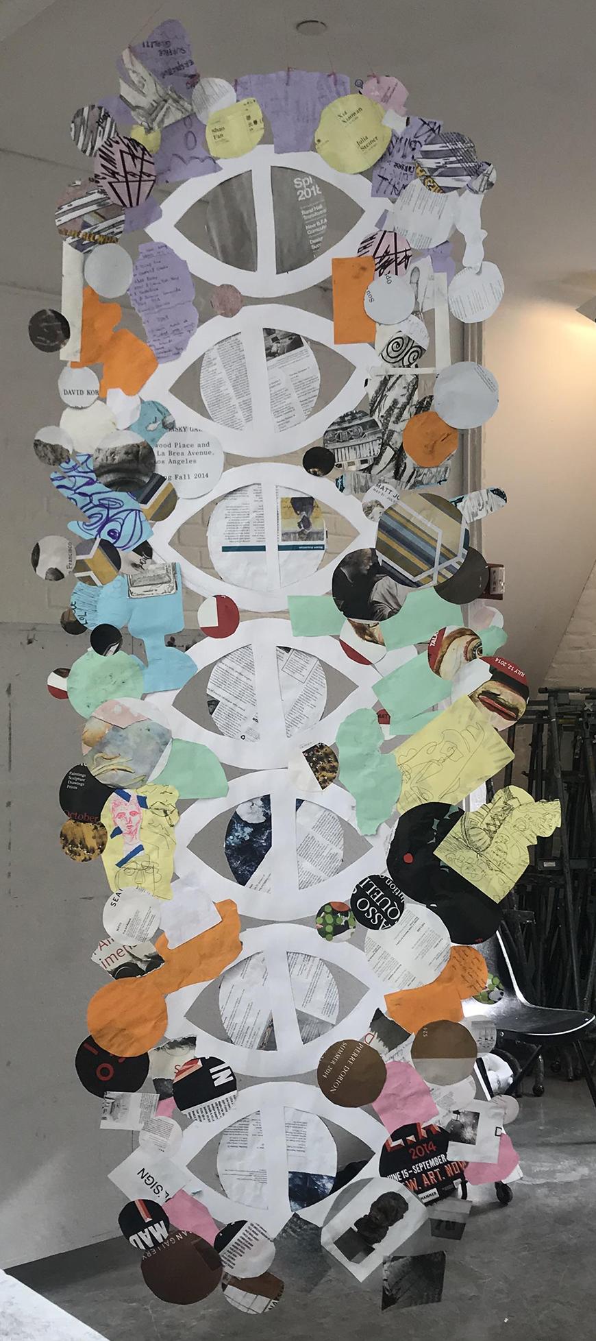 The back of a paper and yarn sculpture.