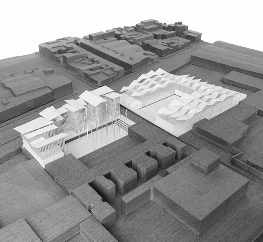 Three dimensional model with covered outdoor areas, residential buildings, and neighboring street corners.