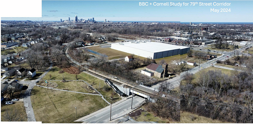 Aerial photo of an industrial region of a neighborhood with a large white building in the center.