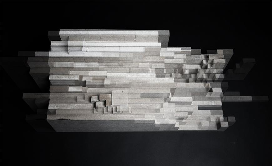 Top view of a concrete architectural model with many ninety degree angles.