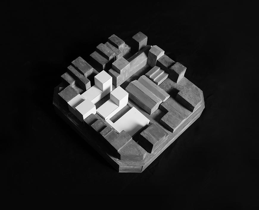 Concrete architectural model illustrating a city block.
