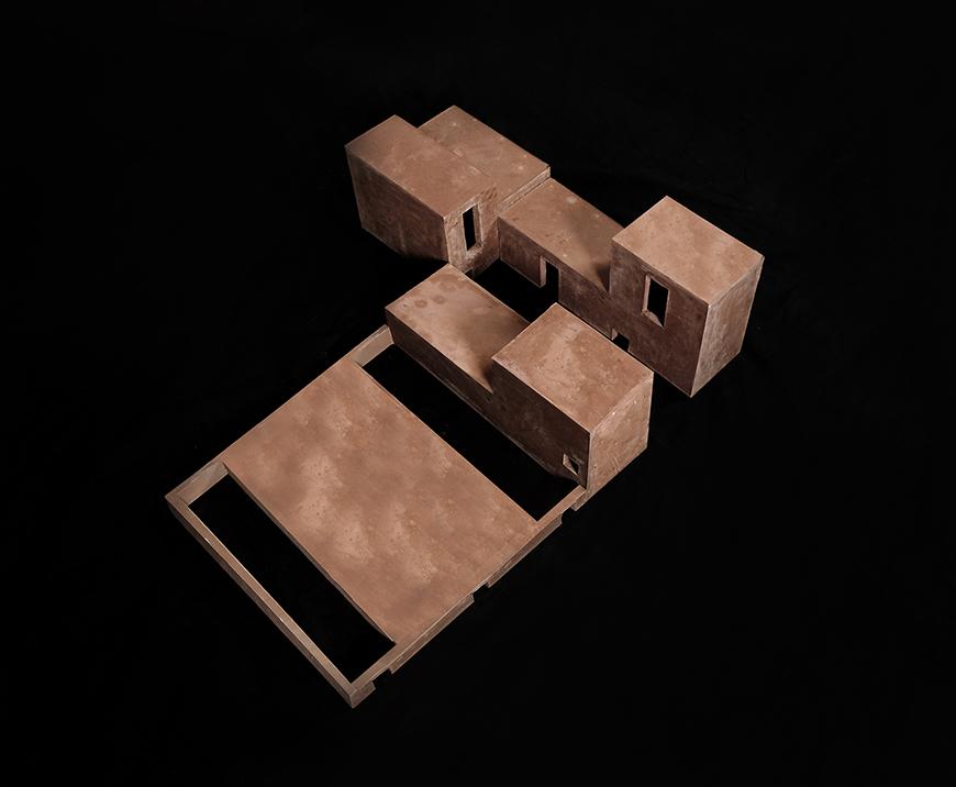 Rockite model of a multi-component building on a black background.
