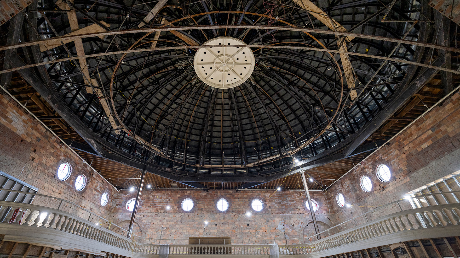 Interior ceiling of a dome with wood scaffolding.