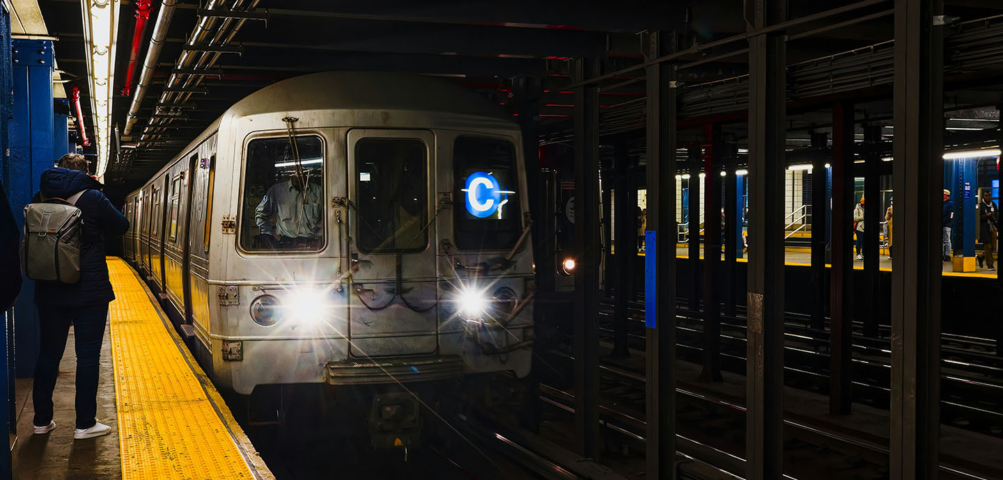 Train pulling up to a subway station