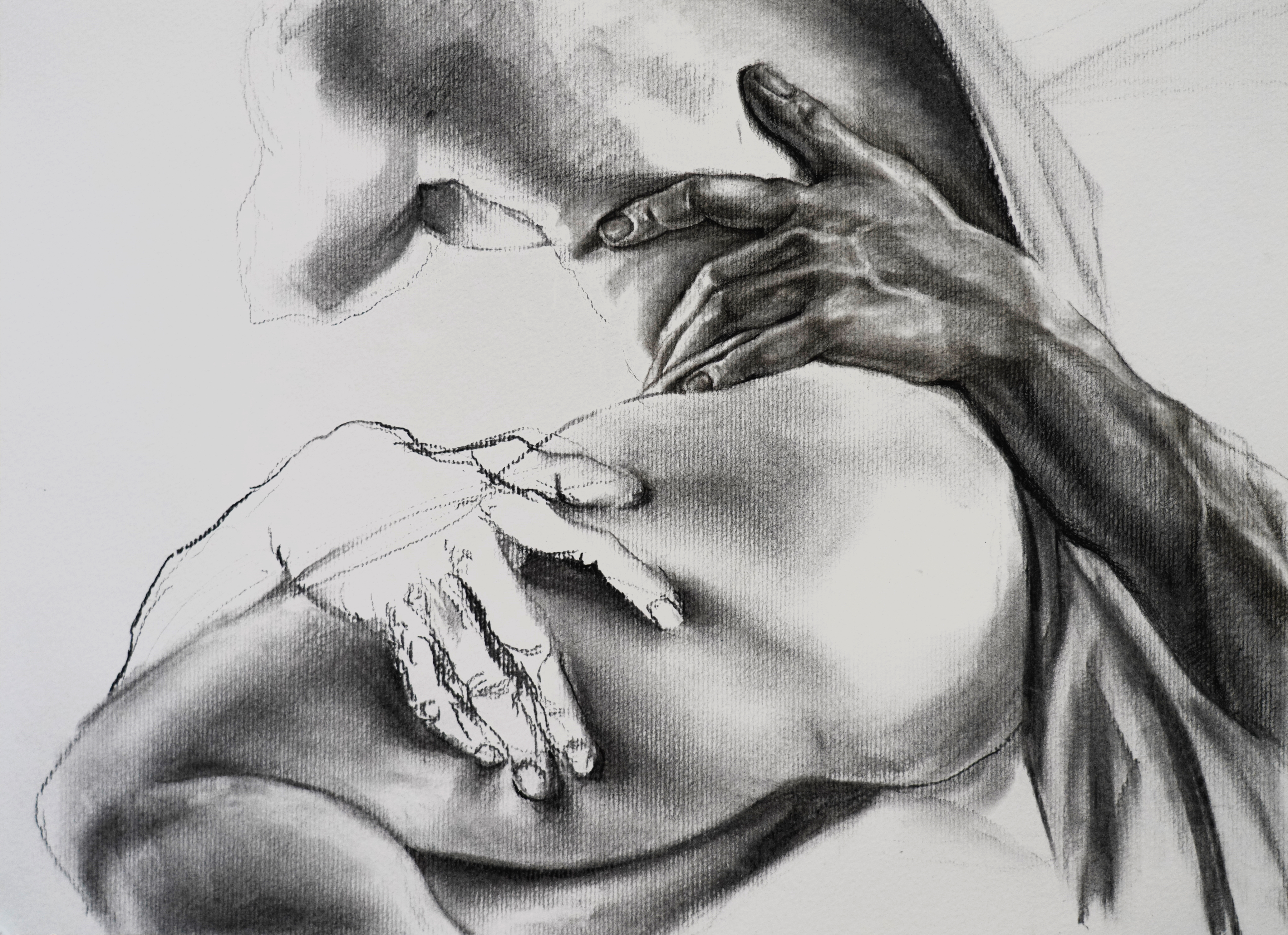 Charcoal drawing of a body.