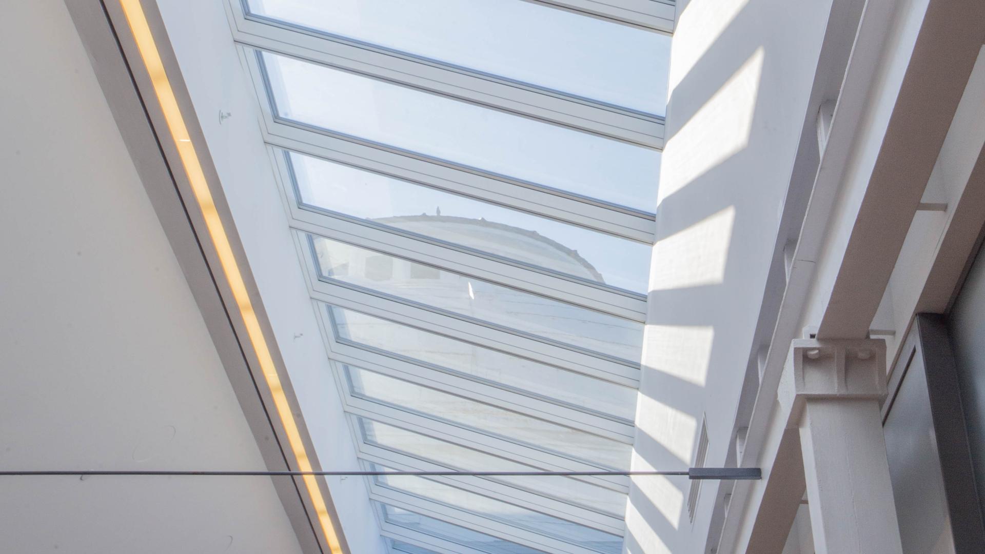 View of a dome through the a glass ceiling.