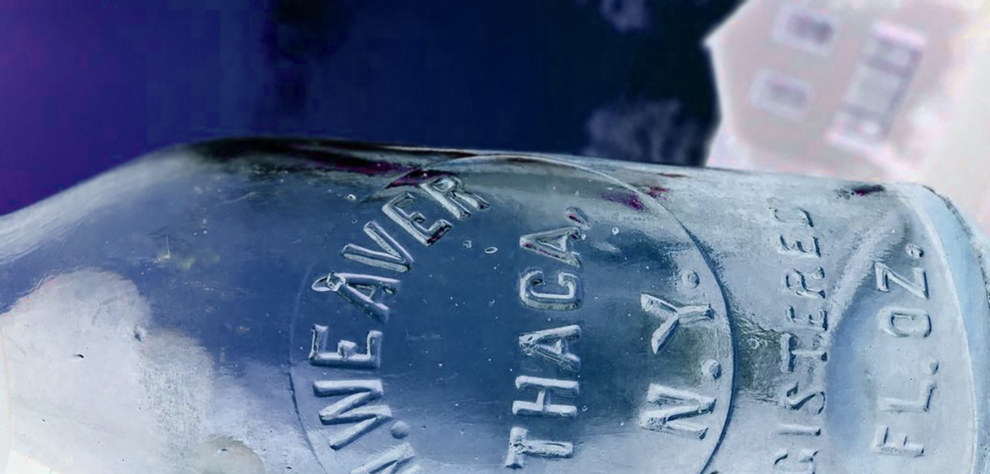 A blue glass bottle lying on its side.