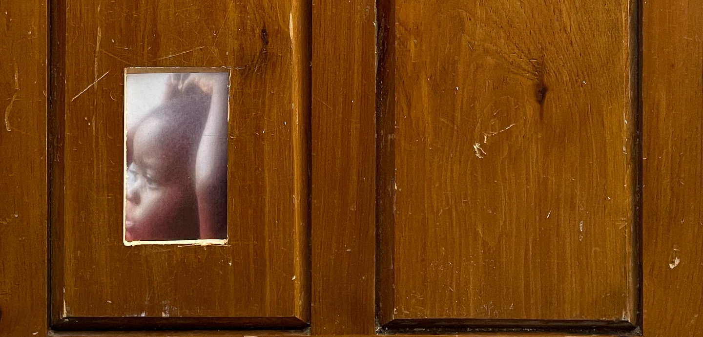 A wood panel with a small rectangular cutout