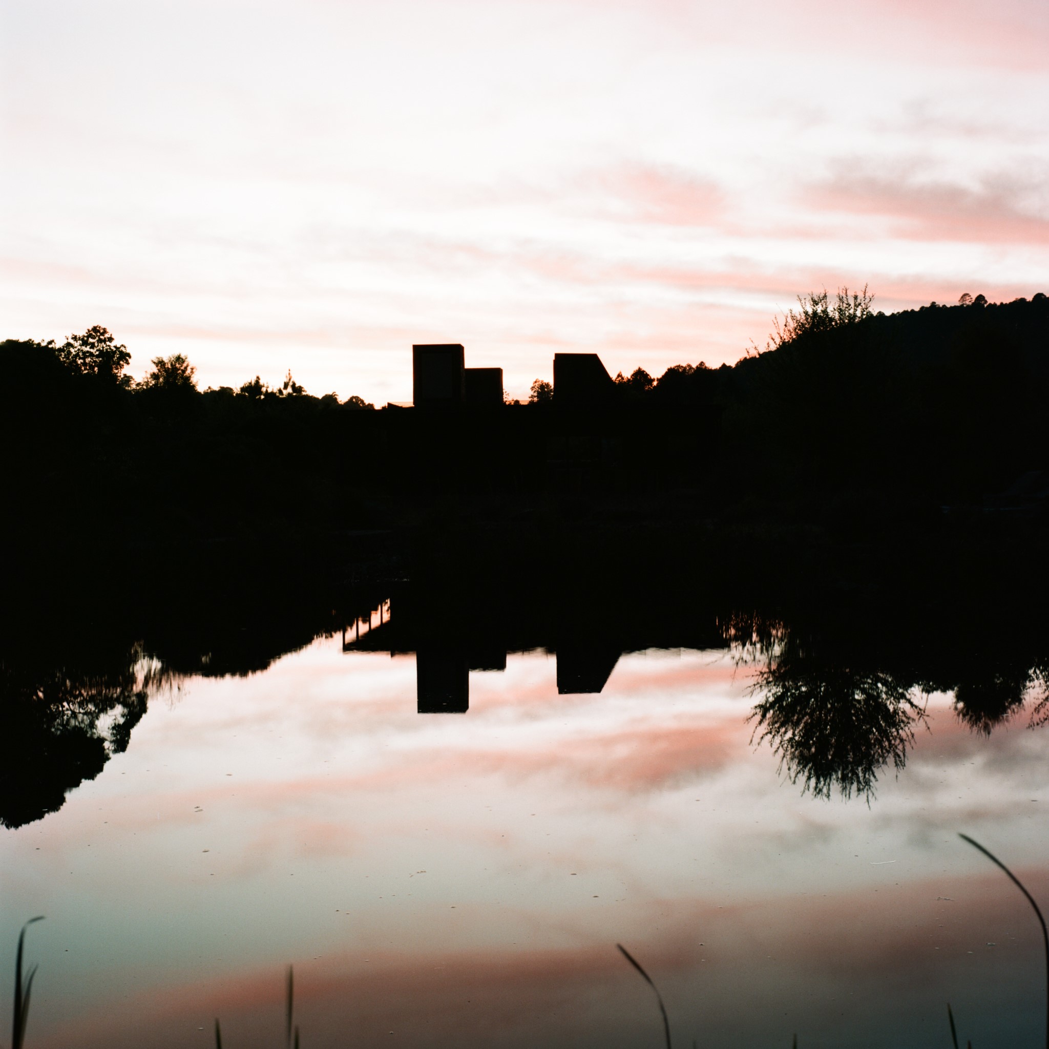 reflective image of a building in shadow