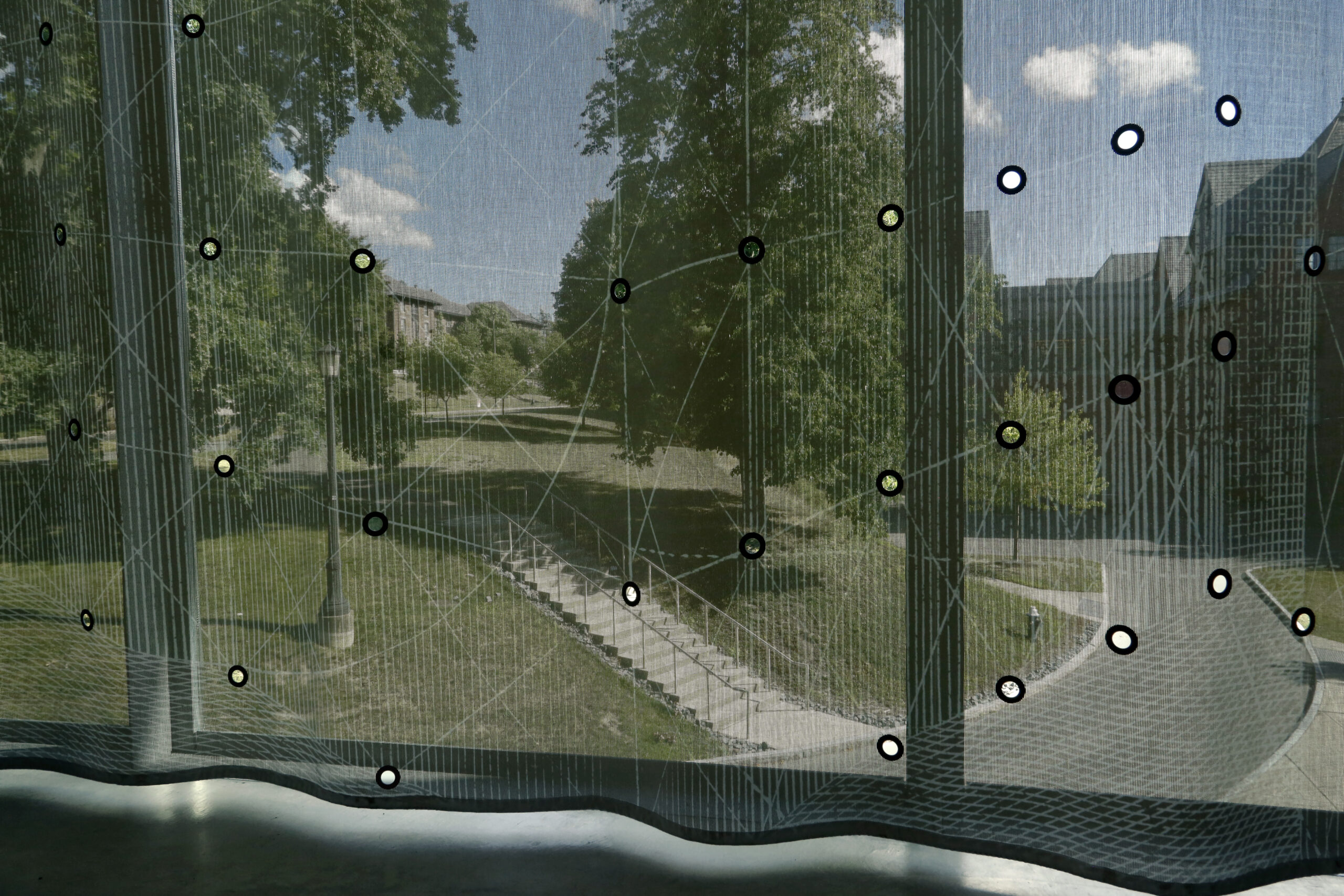 A view of the Cornell campus through the curtain in the south cantilever