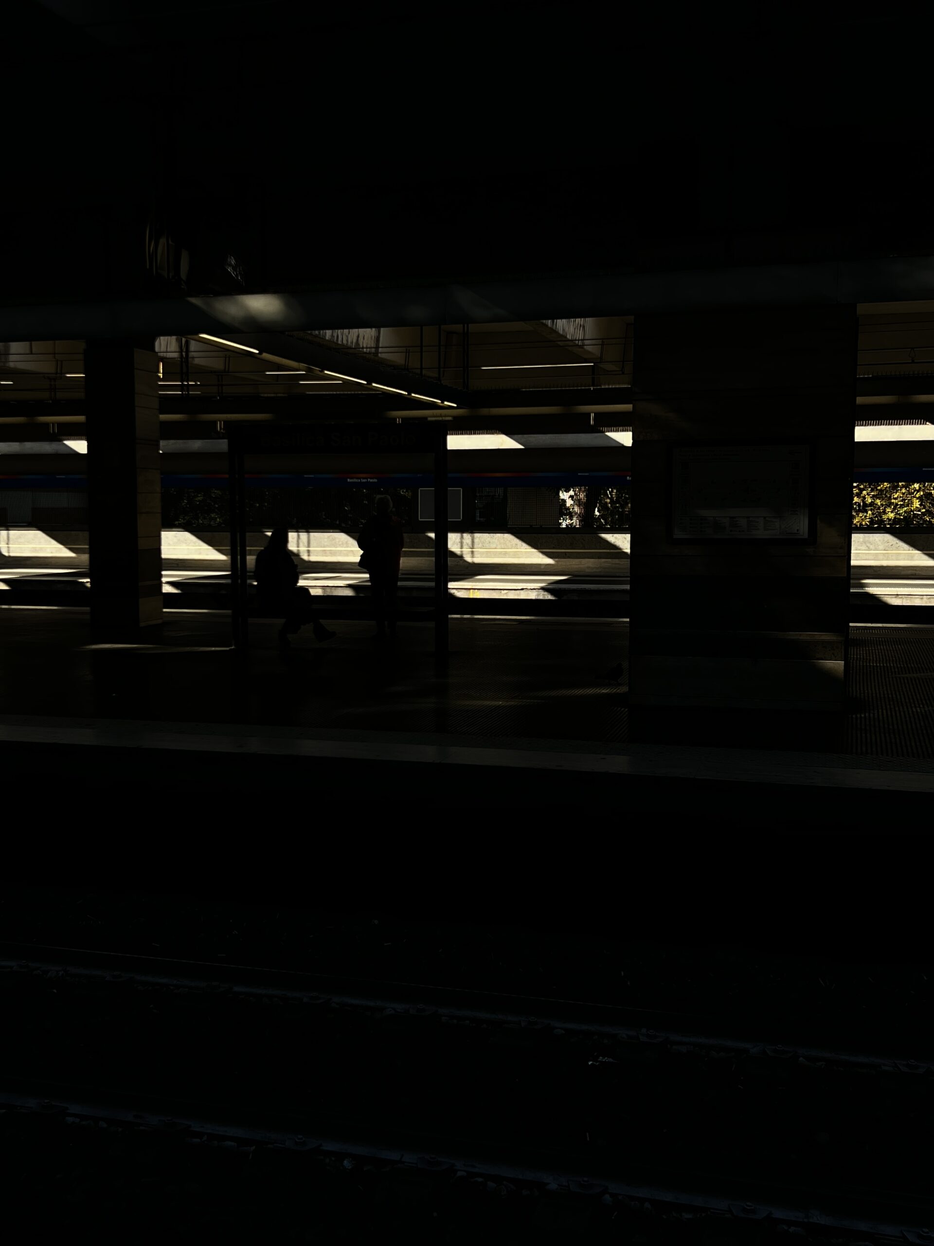 a train station in shadow