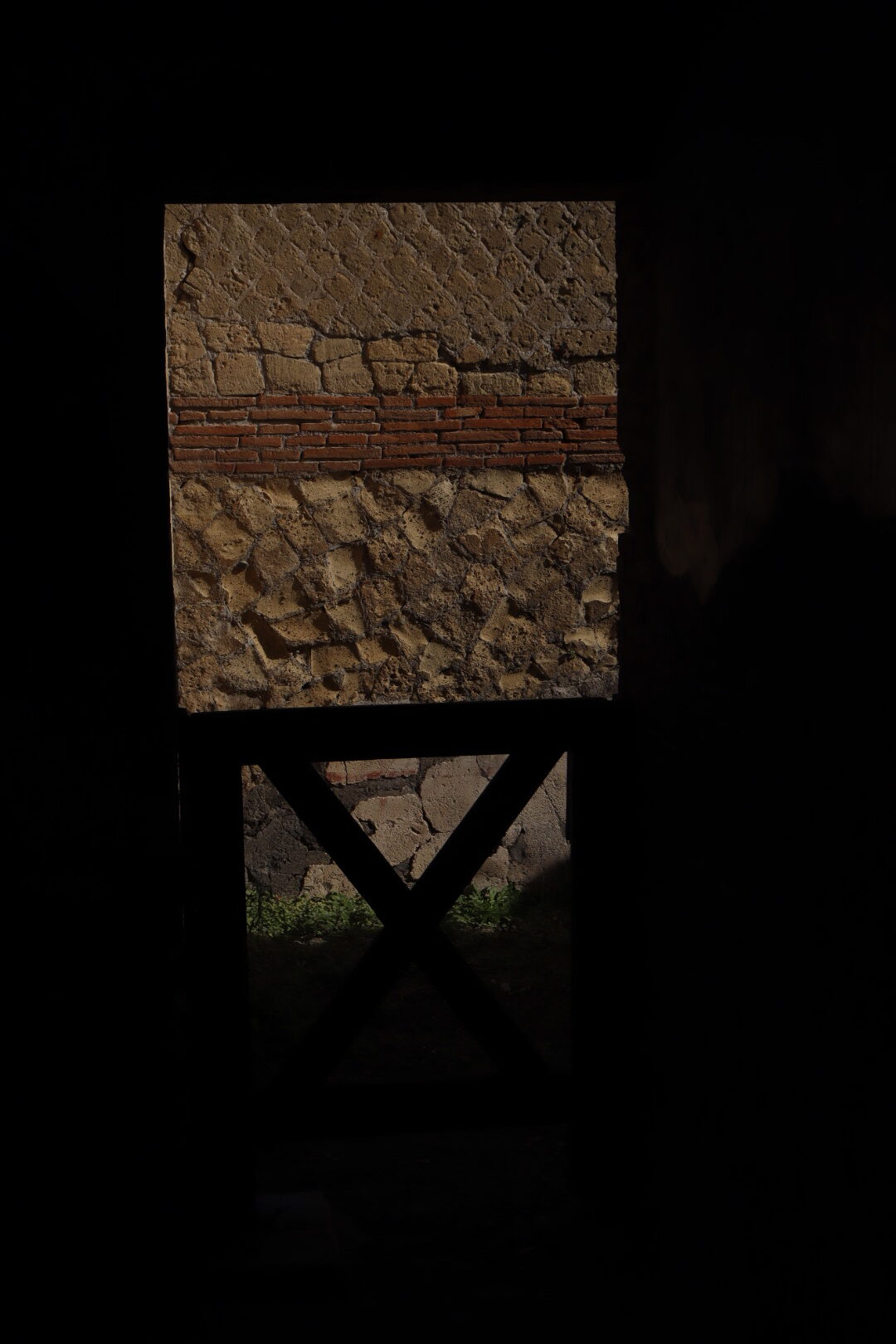 a wall from within a dark room