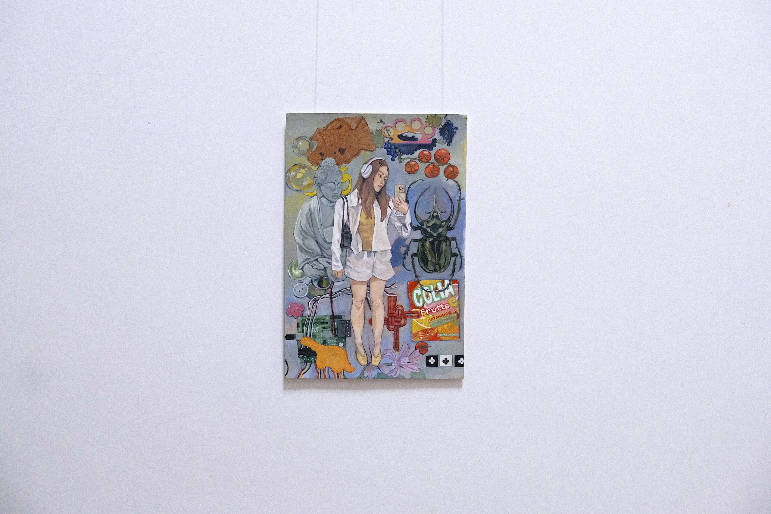 a painting hung on a white wall