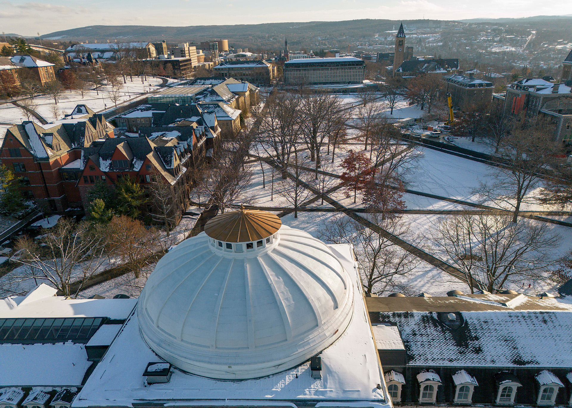 a large domed building covered in snow as part of a college arts quad