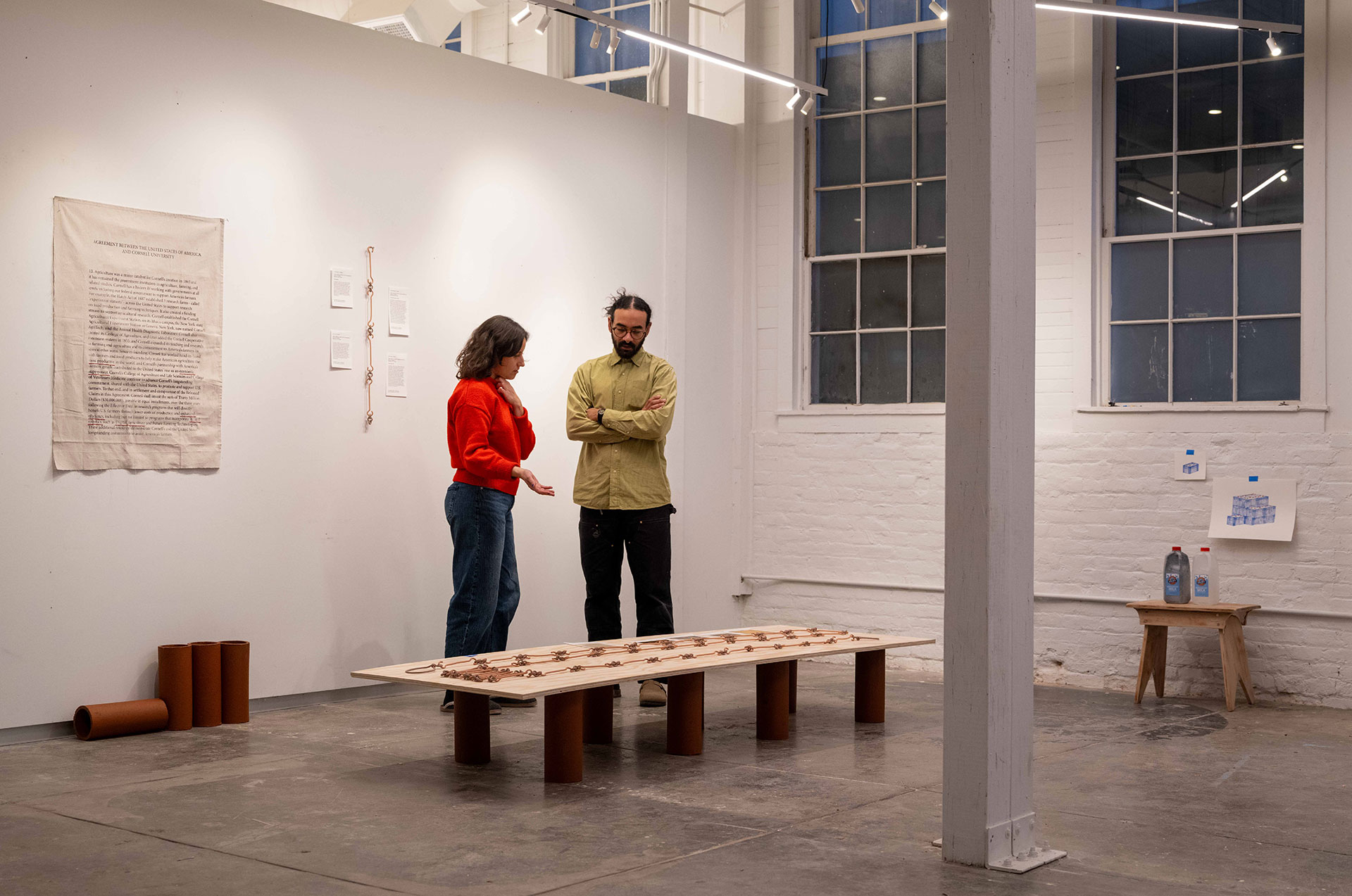 art students examine installed work