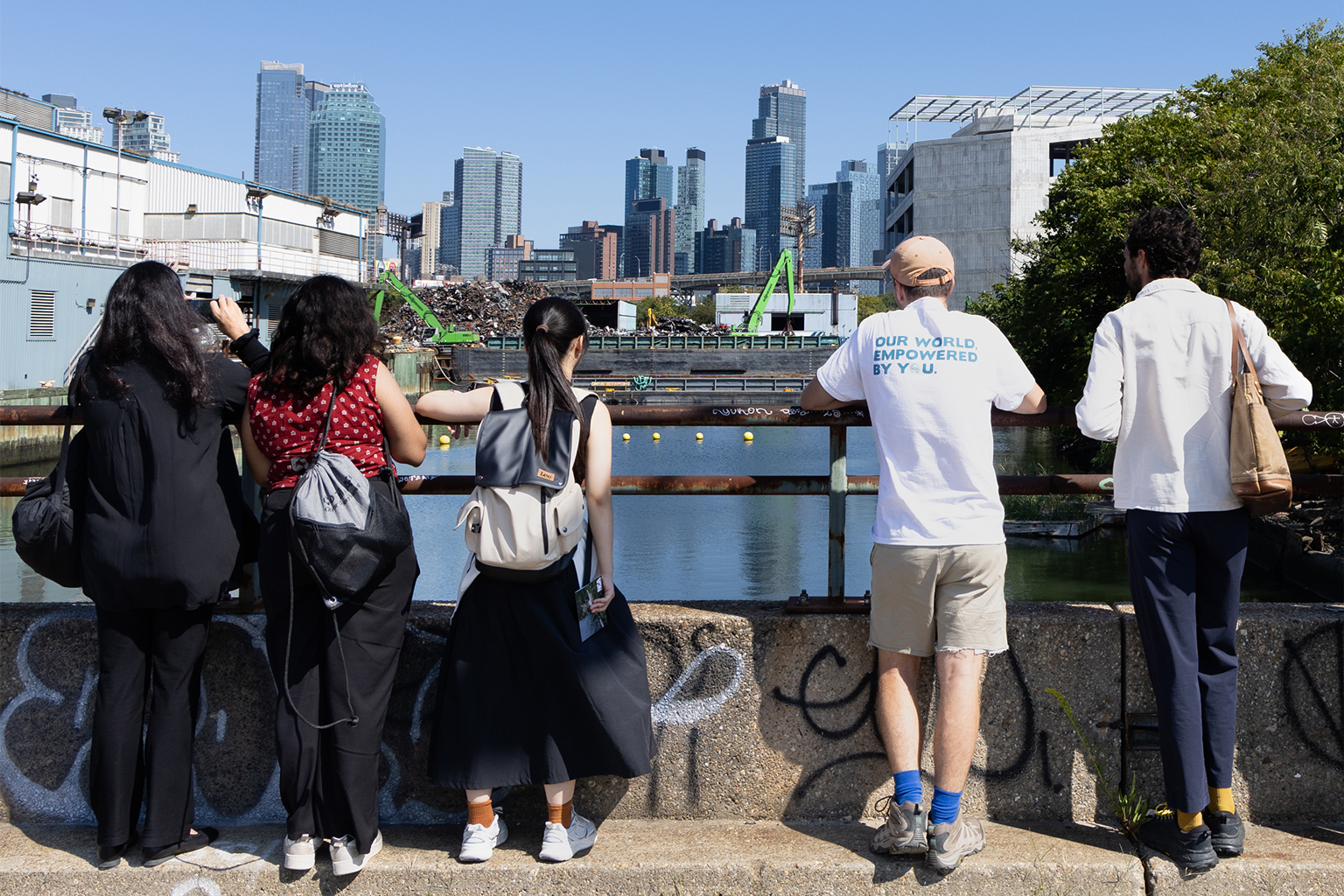 Students on a field trip examine urban infrastructure.