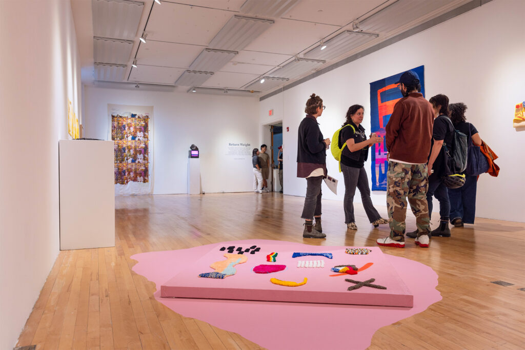 People looking at art in a gallery.