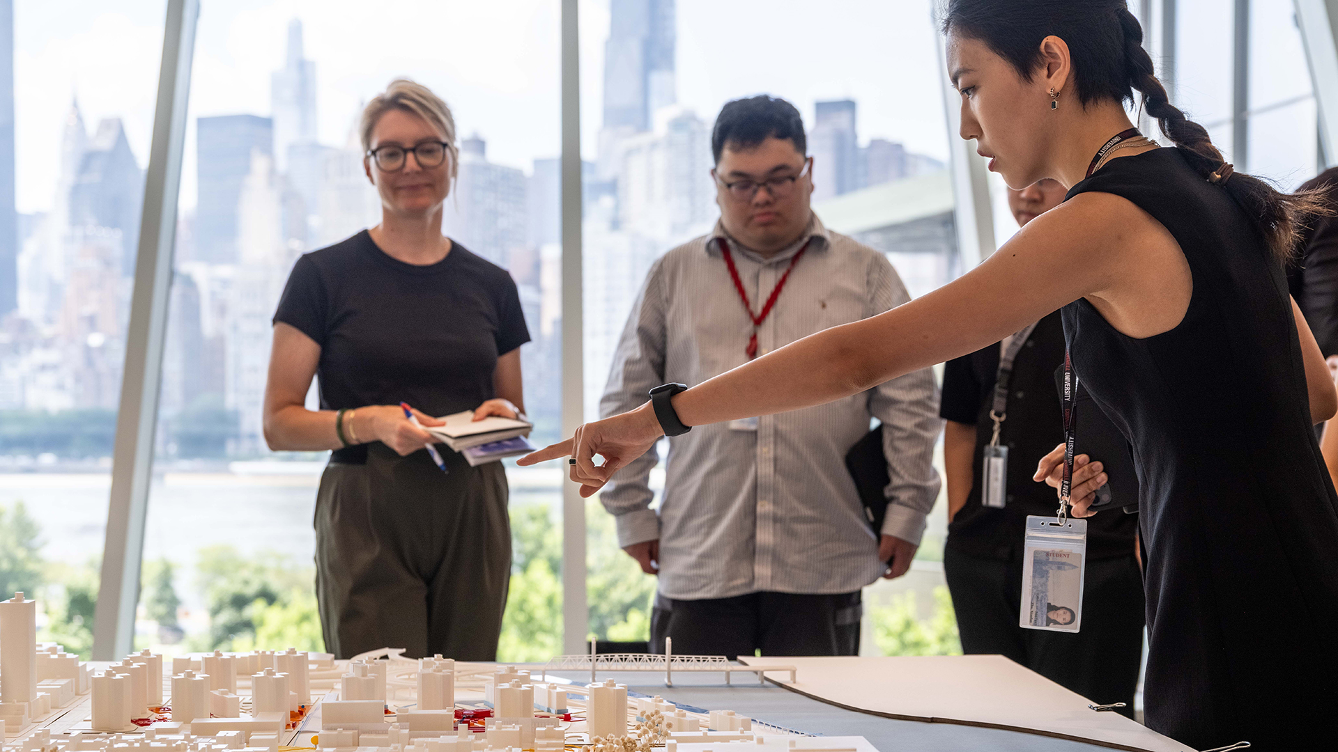 Student pointing at model