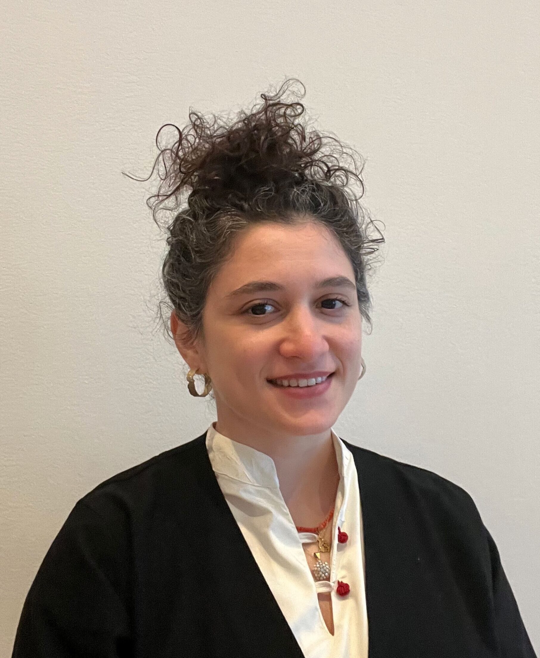 headshot of Asya Uzmay