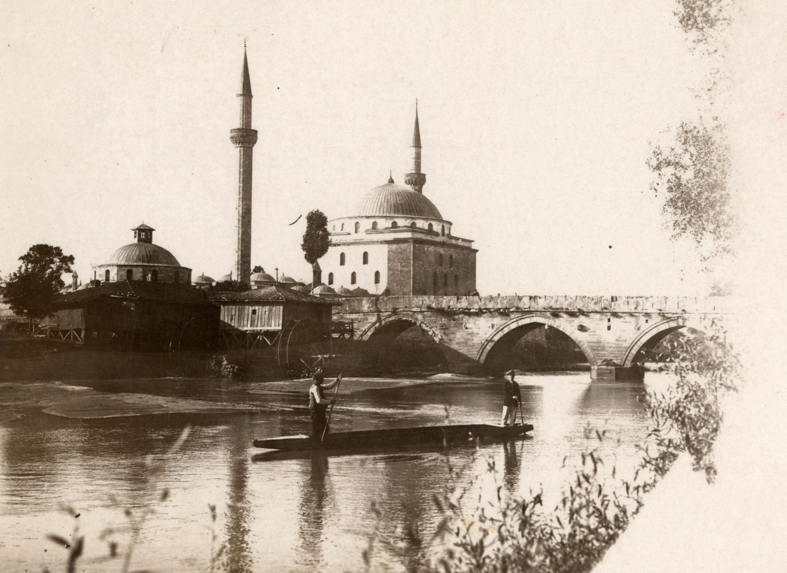 a domed stone building and a stone bridge