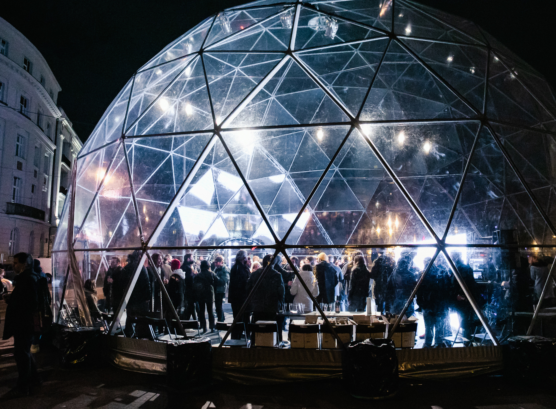 people looking at a glass domed exhibit