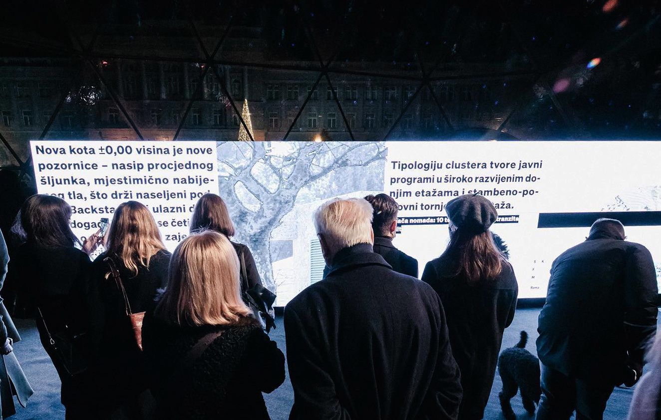 people looking at a lighted exhibit