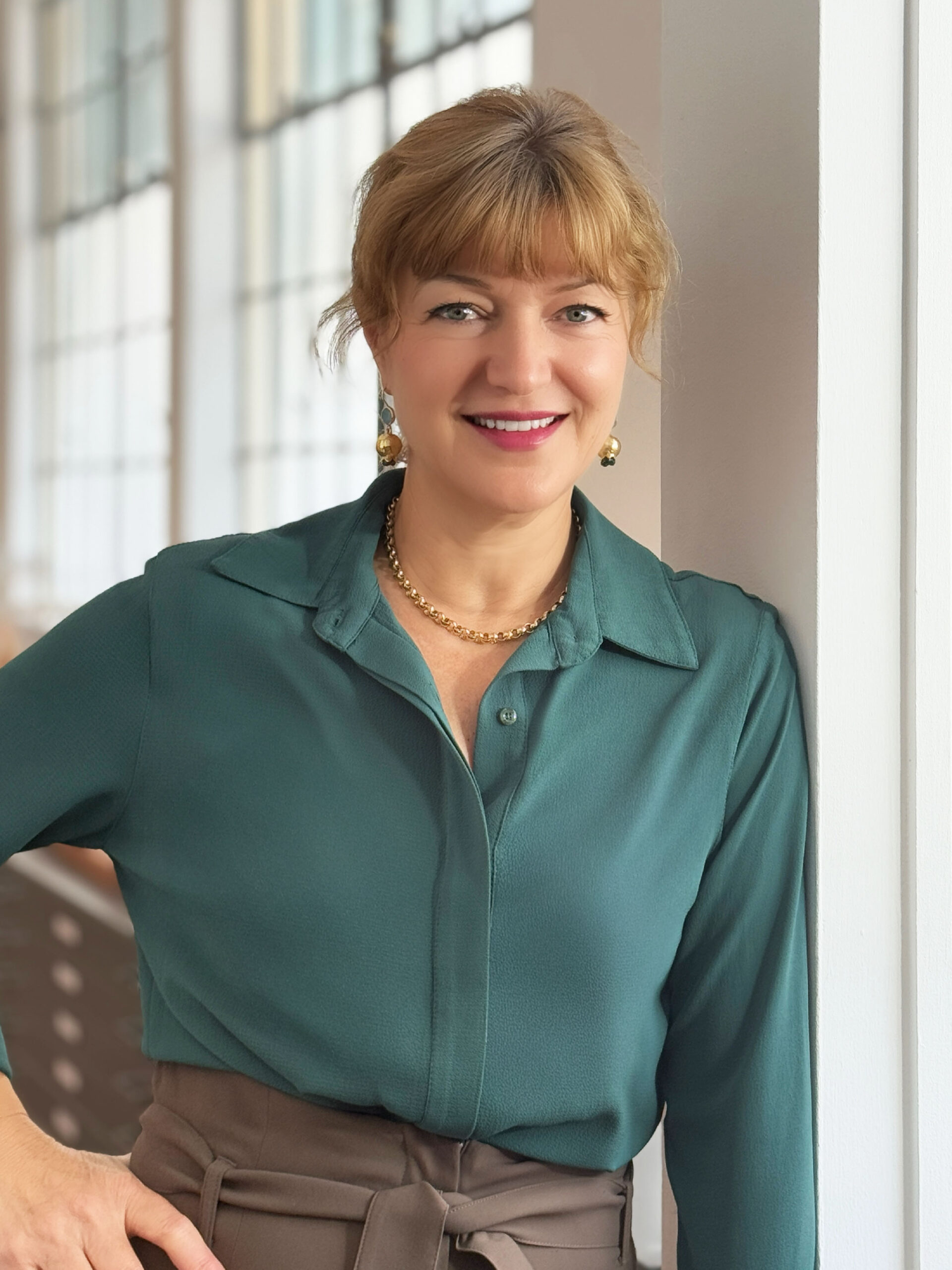 Headshot of architect Galina Tachieva in front of a blurred studio window