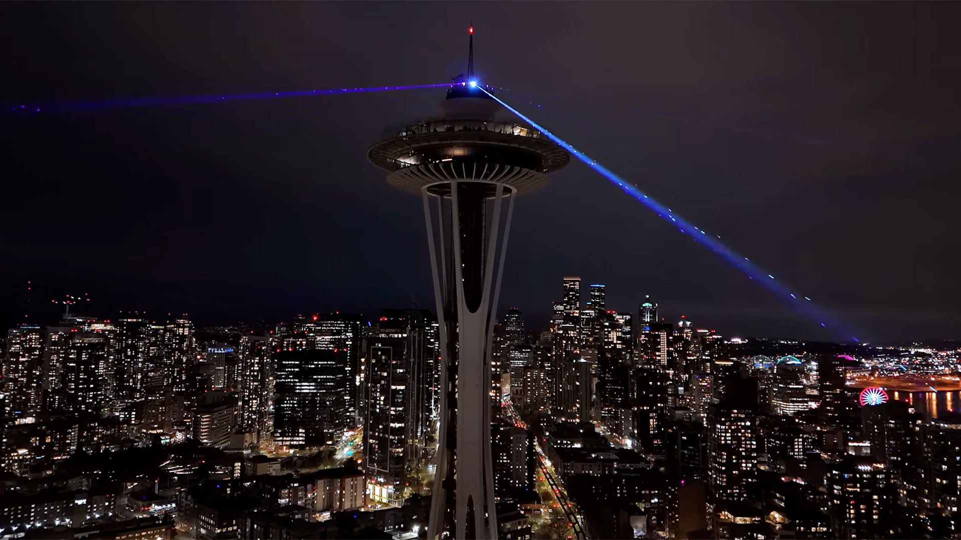 Space Needle lit up at night over Seattle