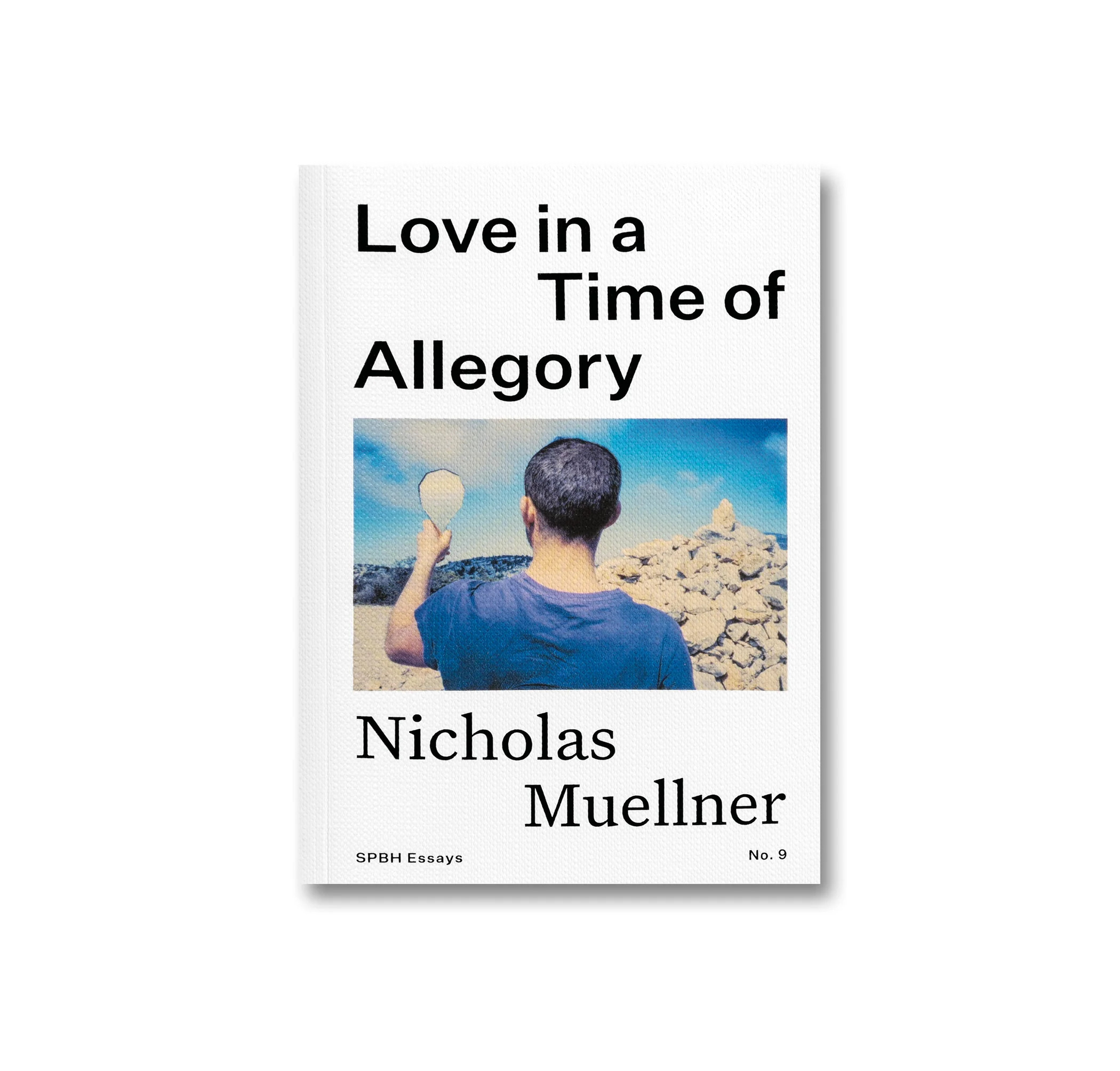 A book cover featuring a man in a blue t-shirt looking into a mirror.