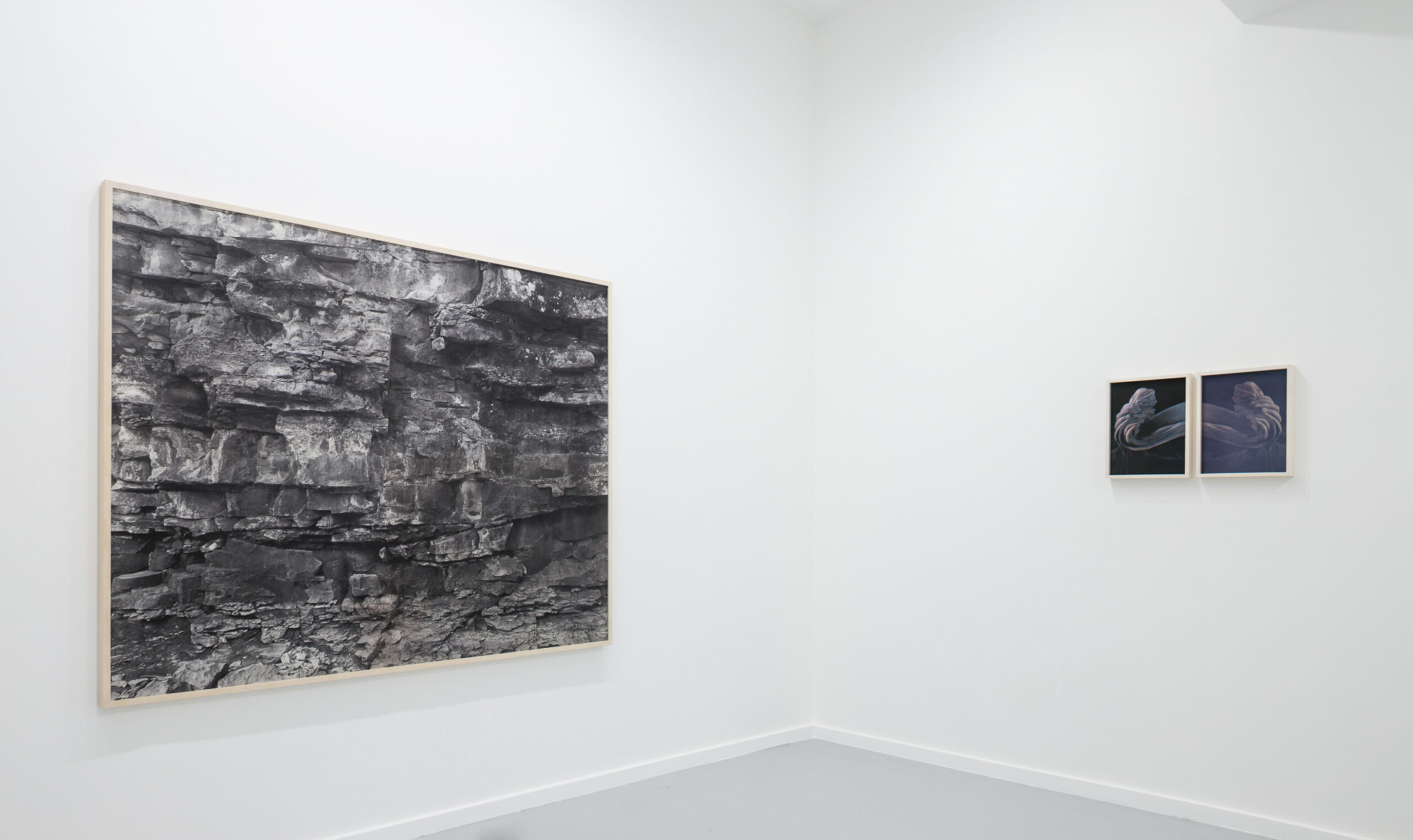 A framed art print of a jagged rock wall.
