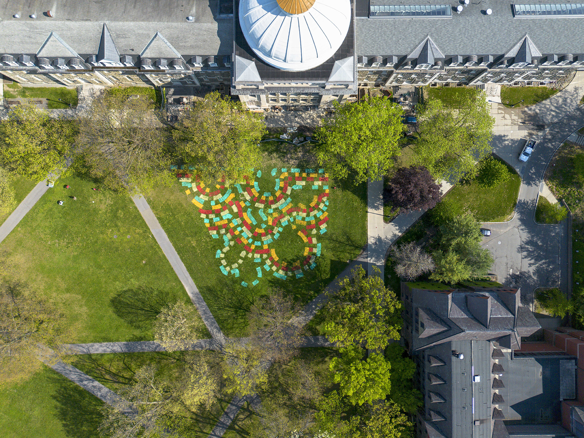 campus building with painted lawn art