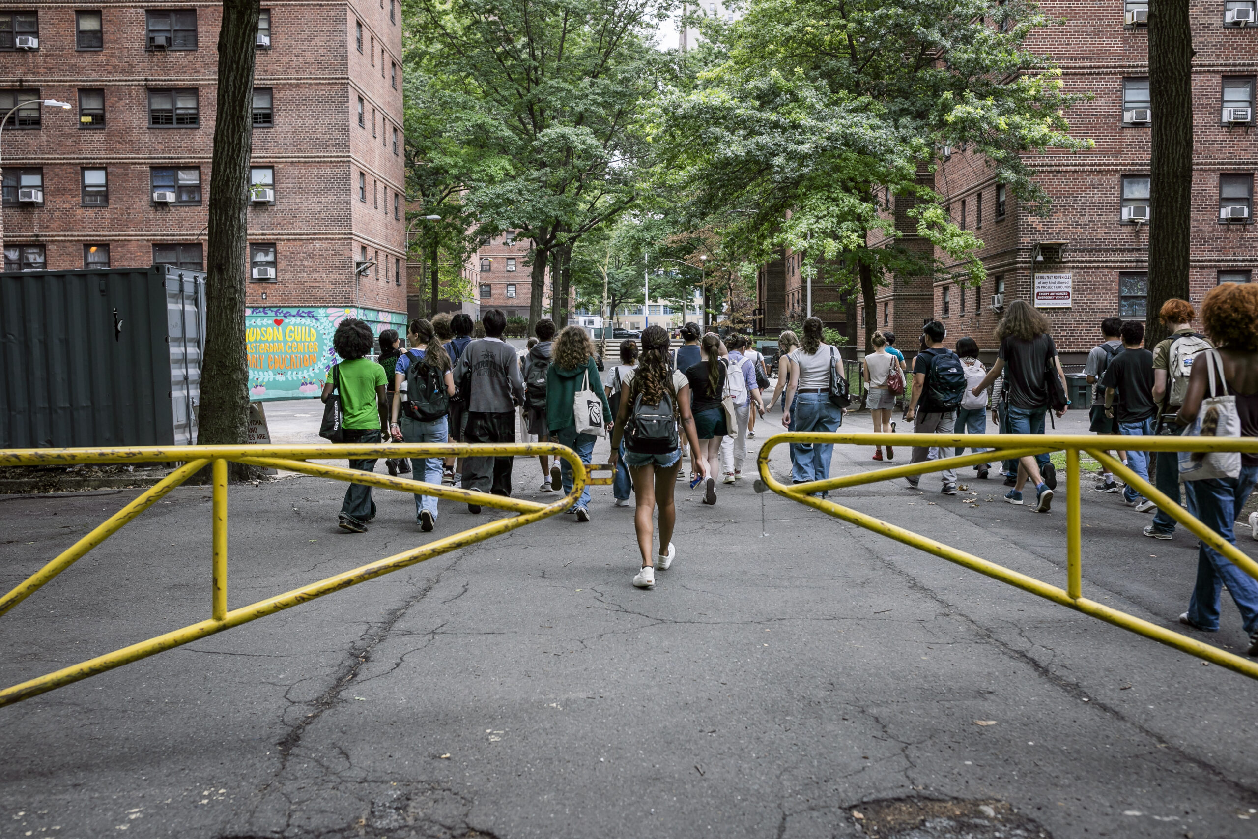 People in a city walking by buildings